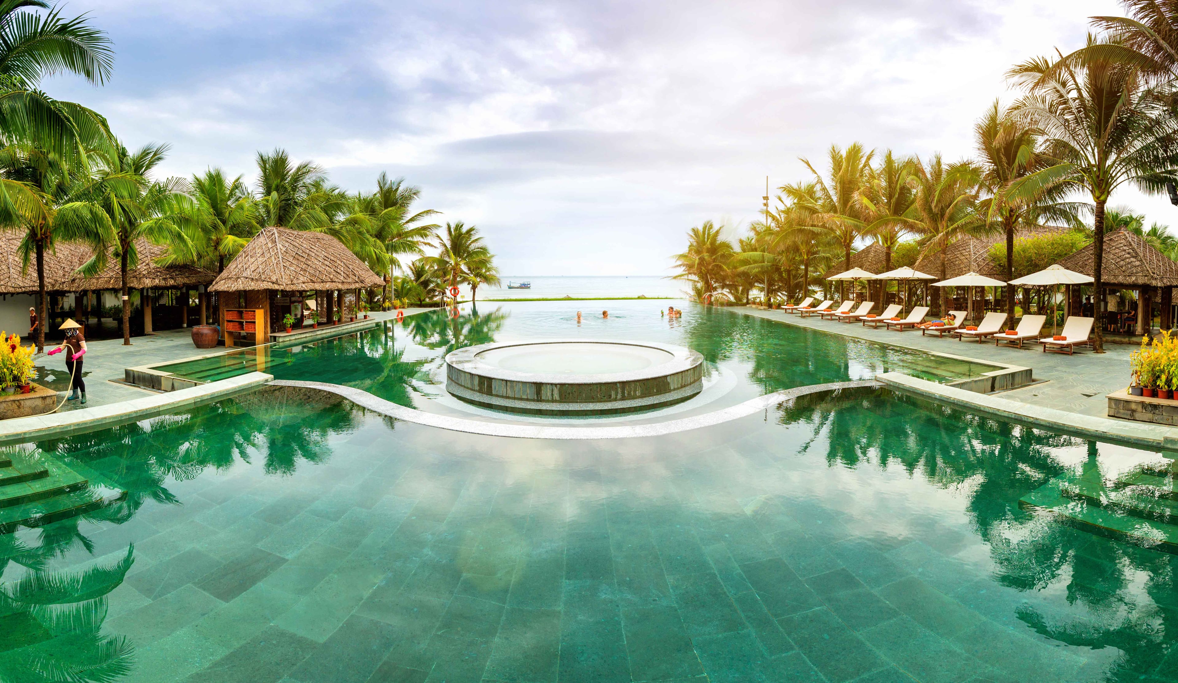 Sonata Resort & Spa infinity pool overlooking ocean with tropical pavilions